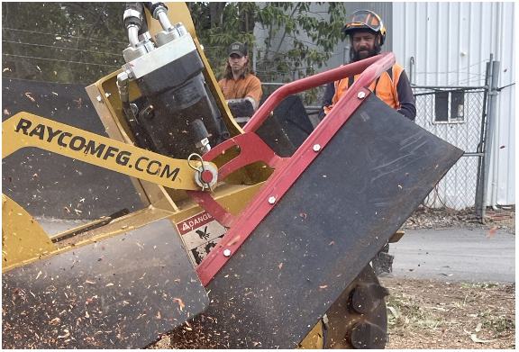 Rayco stump grinder cutting a stump with the operator on the remote, Brisbane